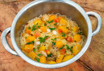 Traditional Brazilian dish rice, chicken and pequi (caryocar brasileinse) known as galinhada goiana