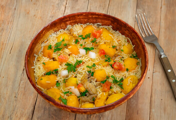 Traditional Brazilian dish rice, chicken and pequi (caryocar brasileinse) known as galinhada goiana