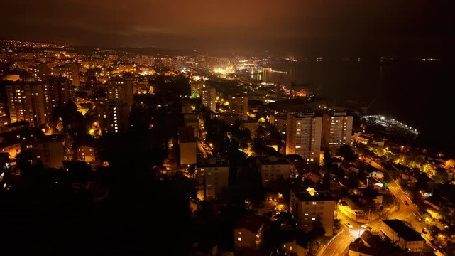 Aerial hyperlapse view of night city Rijeka, Croatia