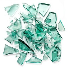 Obraz premium Green broken glass shards lying on white background, representing concepts of destruction, danger and fragility
