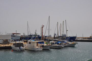 Fototapeta premium The Limassol Old Port with fishing boats and beautiful buildings in Cyprus