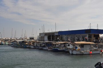 Fototapeta premium The Limassol Old Port with fishing boats and beautiful buildings in Cyprus