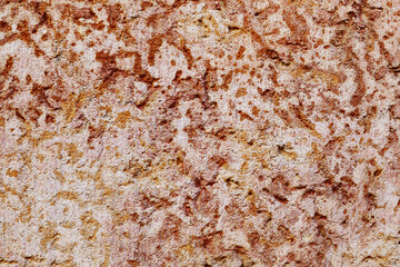 Brown stone wall close up.