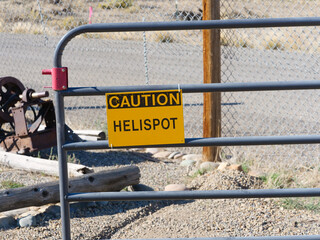 caution helispot sign on the road