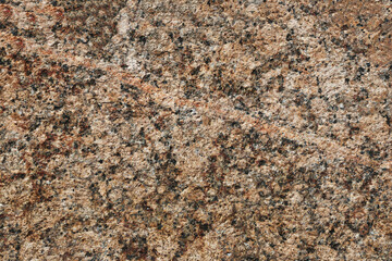 The surface of a large granite stone.