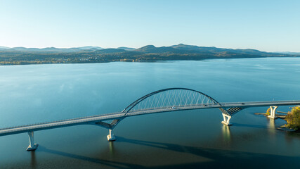 Aerial view of Lake Champlain Bridge, spanning the serene lake and connecting Crown Point, New York to Vermont.