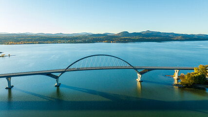 Aerial view of Lake Champlain Bridge, spanning the serene lake and connecting Crown Point, New York to Vermont.