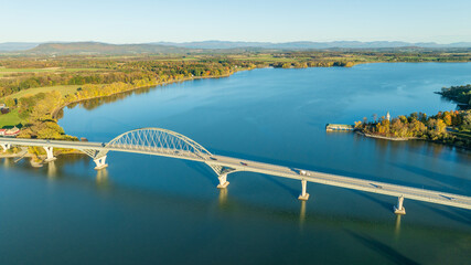 Aerial view of Lake Champlain Bridge, spanning the serene lake and connecting Crown Point, New York to Vermont.