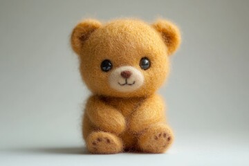 Obraz premium Adorable handmade bear sitting on light background