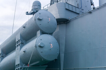 naval military background, concept, fragment of a modern warship with missile launcher containers