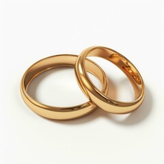 Two golden wedding rings are lying on a white background, symbolizing love, commitment, and the enduring bond of marriage