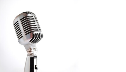 Fototapeta premium Vintage metal microphone on side position provides copy space for text. background concept isolated white