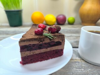 pie with cherries on top and jam inside on a plate. High-quality photo