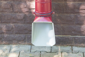 Downpipe.Draining water from the roof of the house.