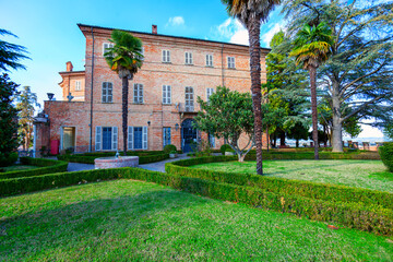 Fototapeta premium View of the castle walls and Its garden of the village of Castell’Alfero (Italy, Piedmont Region, Asti Province). This area is world famous for its valuable red wines and is UNESCO Site since 2014.