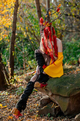 Deer girl in the autumn forest