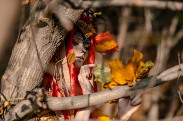 Deer girl in the autumn forest