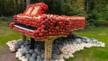 Pumpkin Crafts at fall harvest festival. Halloween farmers market. Concept of seasonal produce, country market and festive fall decorations.