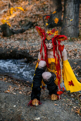 Deer girl in the autumn forest