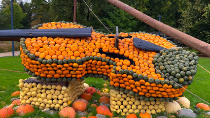 Pumpkin Crafts at fall harvest festival. Halloween farmers market. Concept of seasonal produce, country market and festive fall decorations.