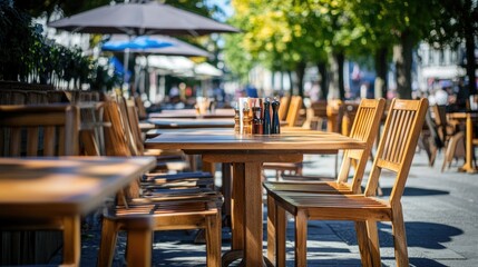 Obraz premium Outdoor Dining Area with Wooden Tables and Chairs
