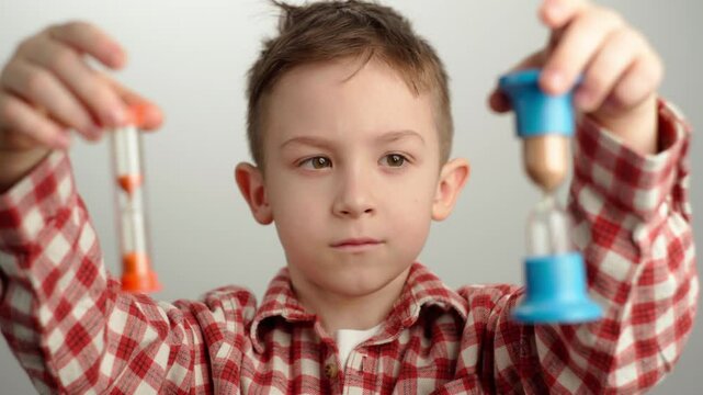 Portrait of a boy holding a sandblaster in his hands.
