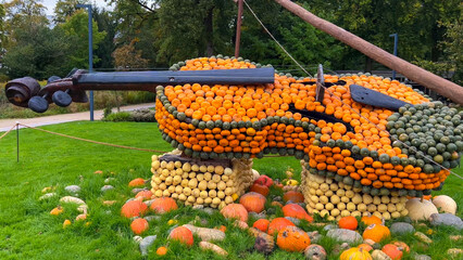 Pumpkin Crafts at fall harvest festival. Halloween farmers market. Concept of seasonal produce, country market and festive fall decorations.