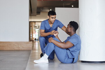 Stress, doctors and comfort with support at hospital for medical success, empathy cheers and healthcare. Men, consoling and fist bump for surgery news, teamwork and communication of emergency crisis