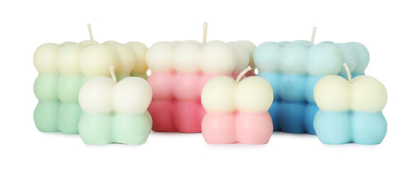 Many beautiful bubble candles isolated on white