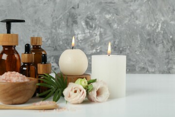 Spa composition with cosmetic products on white table