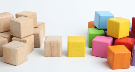 Many wooden colorful cubes on white background