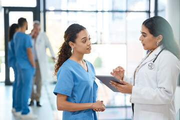 Women, doctor and tablet with discussion in hospital for healthcare schedule, planning surgery and...