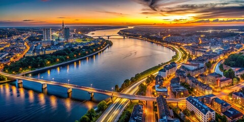 Fototapeta premium Aerial View of Cityscape at Sunset with Bridge and River, urban , cityscape , sunset