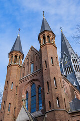 Fototapeta premium Vondel Church (Vondelkerk) had been in use for Catholic worship from 1880. The first stone of this neo-Gothic, cross-shaped basilica was laid in 1872. AMSTERDAM, the NETHERLANDS. 