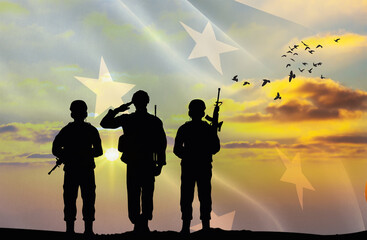 Silhouettes of soldiers with a background of the Micronesia flag and a sunset or sunrise. Concept of national holidays. Commemoration Day.