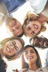 Collaboration, huddle and portrait with smile of business people from below for solidarity or unity. Diversity, face and teamwork with employee friends in circle outdoor for motivation or support