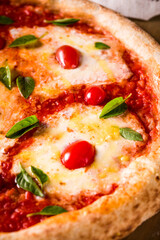 Delicious Traditional Margherita Pizza with Fresh Basil and Cherry Tomatoes