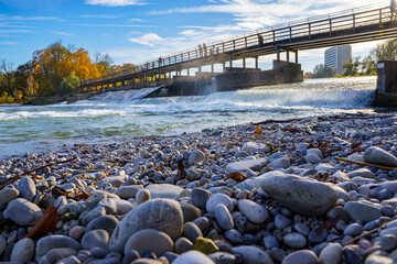 The Flauchersteg, a pedestrian and bicycle bridge over the Isar in Munich, Germany. A weir and...