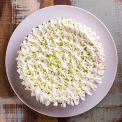 Top View of Creamy Cake with Whipped Topping and Lime Zest