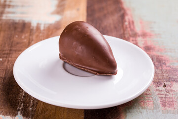 Delicious Chocolate On White Plate With Wooden Background