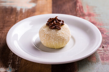 Delicious Beijinho Dessert with Chocolate Topping on White Plate