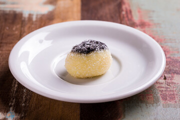 Delicious Coconut Dessert With Chocolate Topping on White Plate