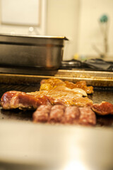 Juicy steaks sizzling on the grill. Great for BBQ advertisements, steakhouse promotions, or grilling recipes.