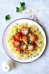 Pasta spaghetti with meat ball in tomato sauce on a plate . Top view with copy space.