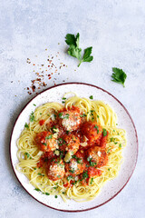 Pasta spaghetti with meat ball in tomato sauce on a plate . Top view with copy space.