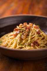 Delicious Italian Spaghetti Carbonara with Crispy Pancetta and Herbs
