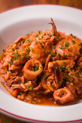 Delicious Seafood Paella With Calamari and Shrimp Garnished With Fresh Parsley