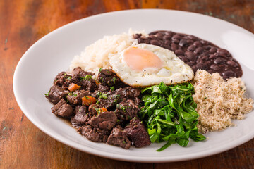Delicious Brazilian Picadinho Plate With Rice and Fried Egg