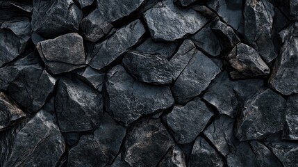 Fototapeta premium The backdrop features a textured surface composed of rugged grains in shades of dark gray and black stone