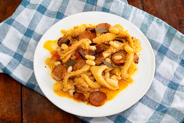 Beef tripe (bucho), beef stomach, tripe on a white plate. Dobradinha